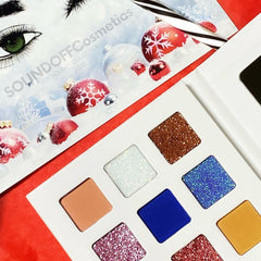Holiday eyeshadow palette featuring glitter and matte shades in warm neutrals and festive jewel tones