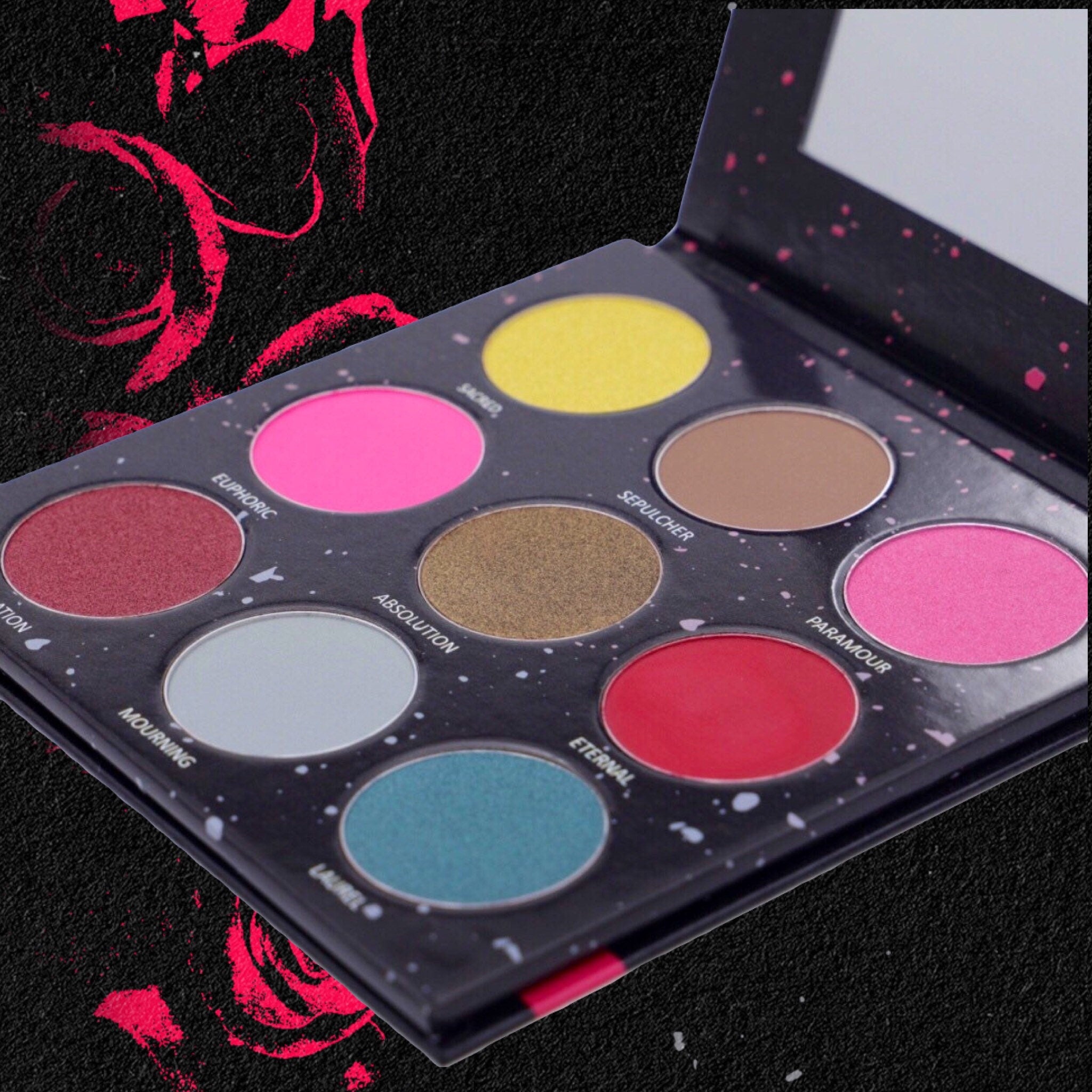 Divine Tragedy eyeshadow palette featuring dark gothic shades in matte and shimmer finishes with ornate packaging