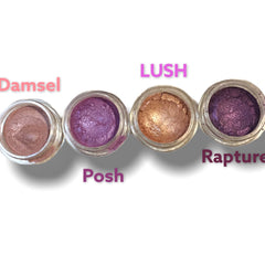 Eyeshadow pots with metallic shimmer in brown, purple, and gold colors, Lush, Posh, Rapture labels
