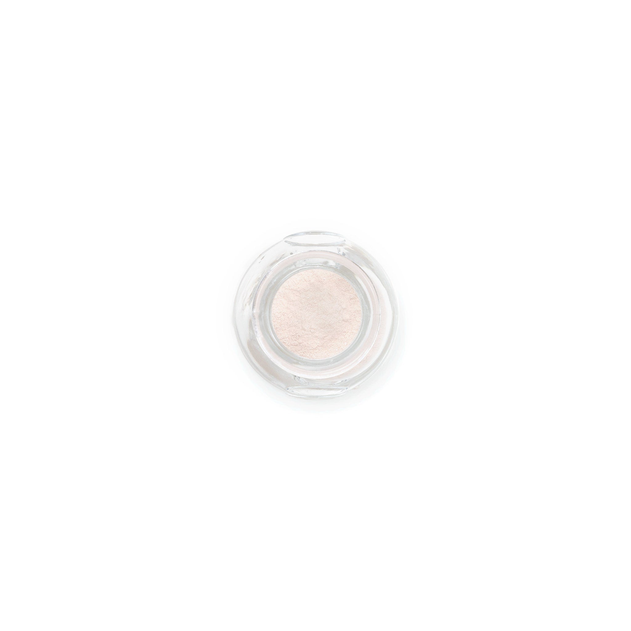 Powder compact with clear glass container and light pink powder inside