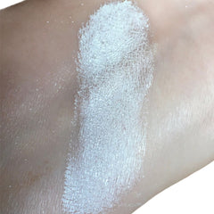 Side view of iridescent mineral eye shadow duo showing Snowflake White and Fairy Wings Pink pans in compact