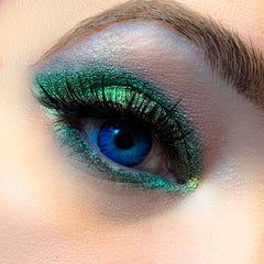 Eye makeup with green eyeshadow, blue eye, and black eyelashes