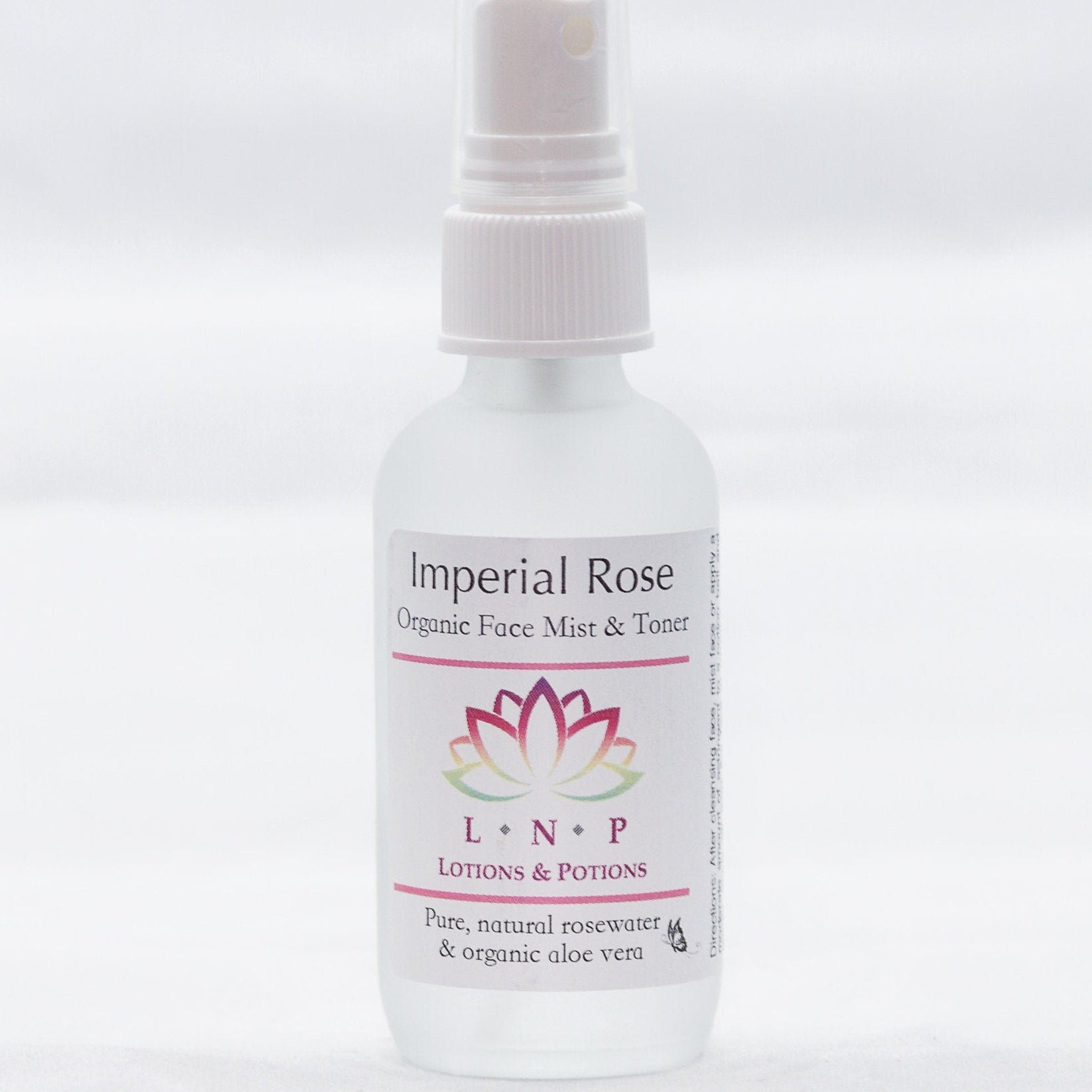 Facial toner spray bottle, white plastic, "Imperial Rose" label, "Lotions & Potions" brand