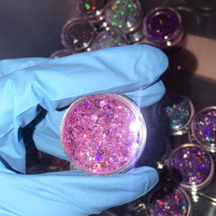 Close-up of iridescent chunky glitter in assorted colors with sparkling reflective particles for eye makeup