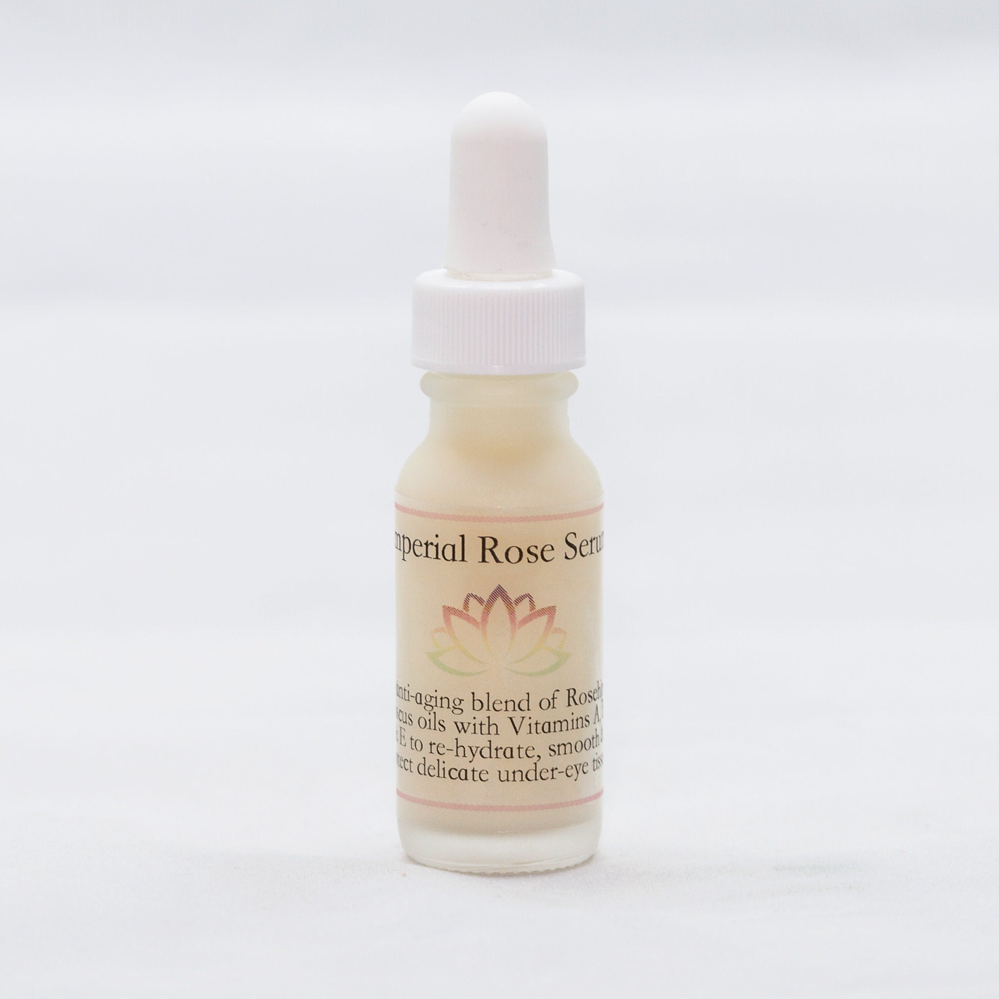 Rose serum bottle with white dropper, beige liquid, and "Imperial Rose Serum" text label