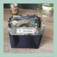 Fabric basket with floral pattern, navy blue fabric, and L&A Création label