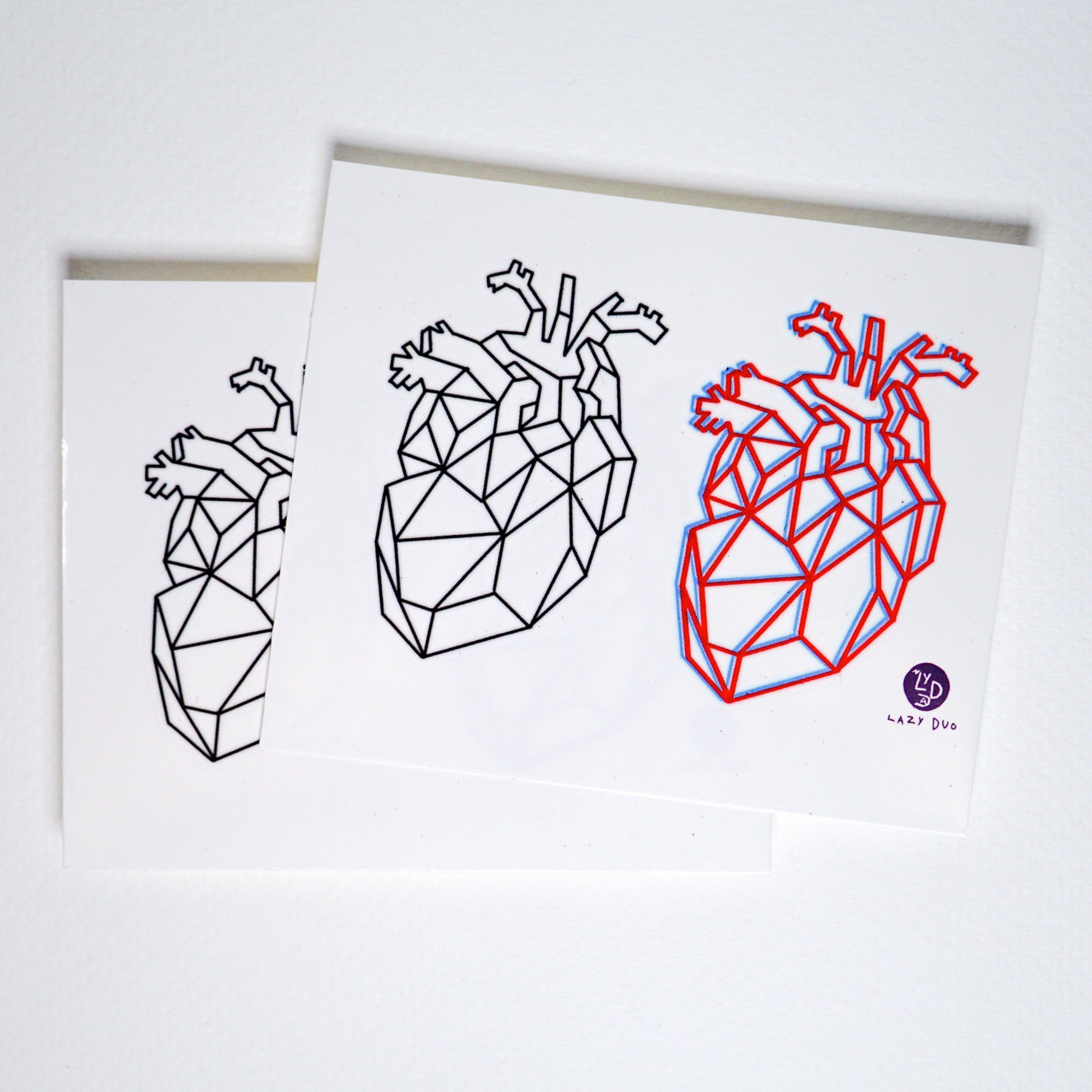 Close-up of red geometric heart temporary tattoo with glossy finish, showcasing skin-friendly adhesive details