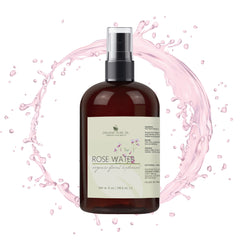 Rose water bottle with brown glass, black spray top, and pink splash background
