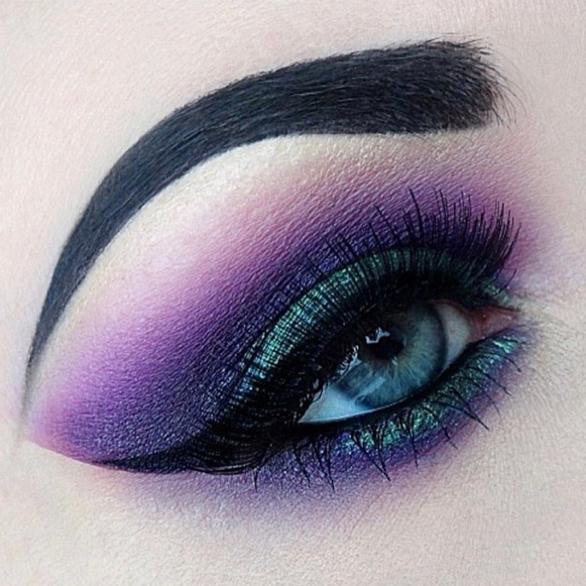 Side view of Queen Pro Matte Eyeshadow palette showing sleek black compact with angled mirror and matte finish.