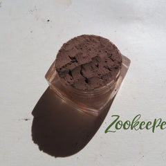 Eye shadow dark brown powder in clear jar with Zookeeper text visible