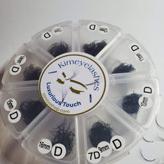 Eyelash extensions in black, clustered style, with Kimeyelashes brand label and size indicators