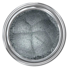 Silver eyeshadow in a round container with silver metallic rim and glitter texture
