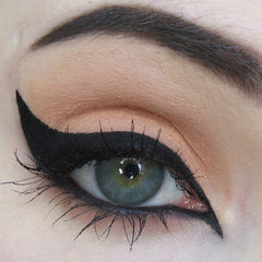 Eyeliner wing black liquid with long lashes and eyebrow makeup on eye