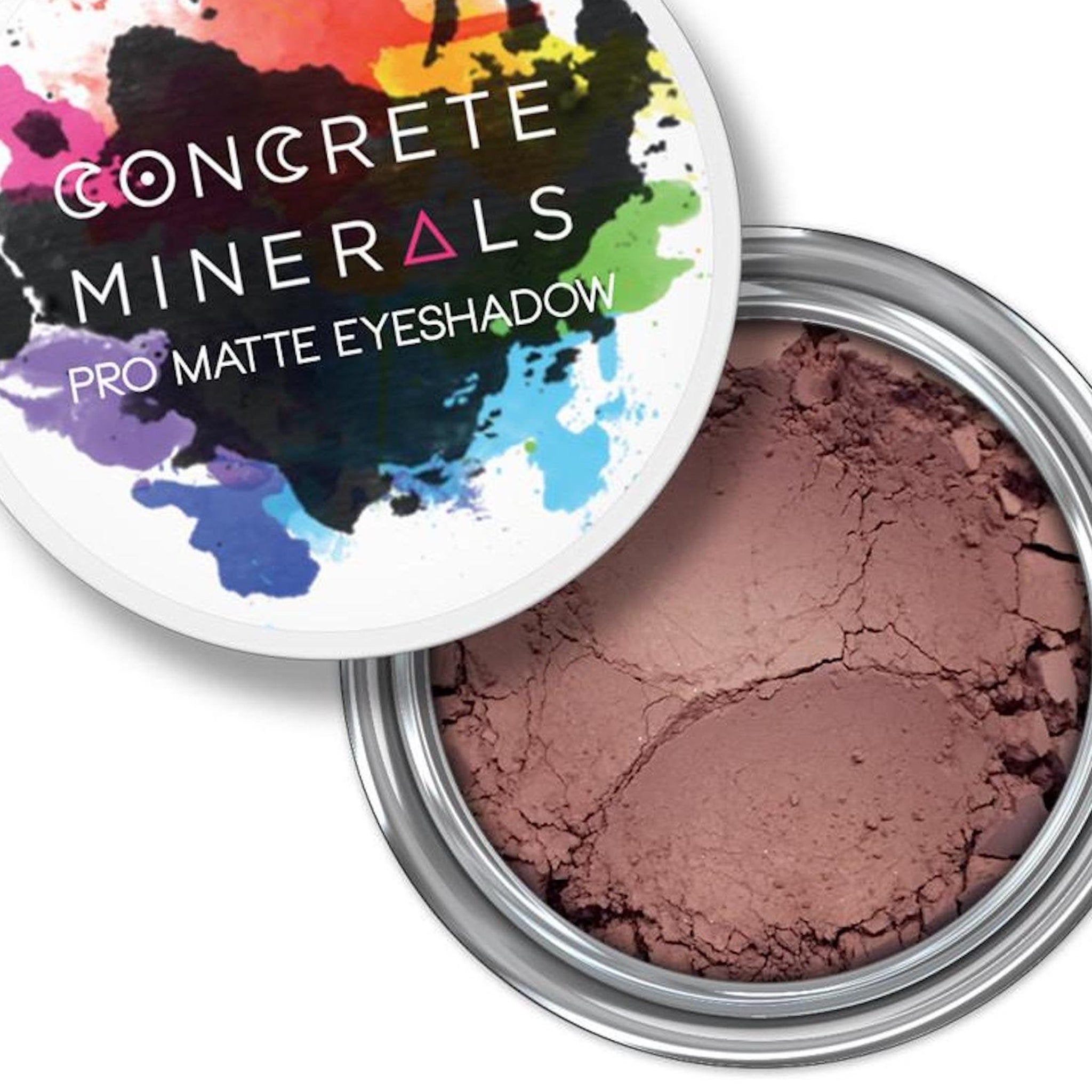 Eyeshadow powder with brown color, cracked texture, and silver metal container with Concrete Minerals text