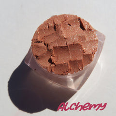 Open jar of brown gold loose mineral eyeshadow with golden shimmer, vegan and cruelty-free