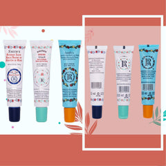 Lip balm tubes with white, blue, and orange caps, featuring floral patterns and brand text