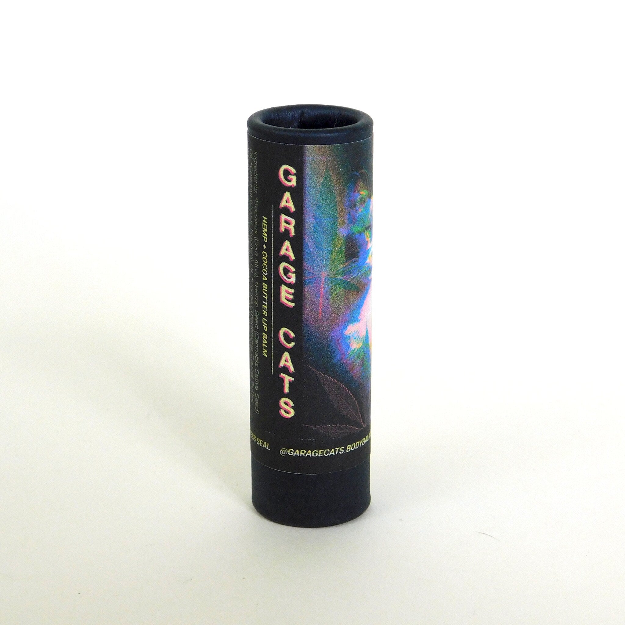 Lip balm tube, black cardboard, holographic label, Garage Cats brand name visible