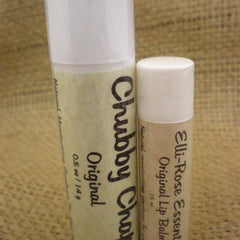 Lip balm tubes, white and beige with black text, standing upright on a textured surface, Chubby Char and Elli-Rose brands