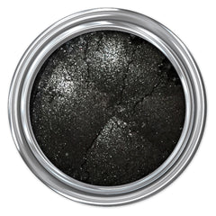 Close-up of matte black mineral eyeshadow pan with smooth, pigmented powder texture and vegan certification label