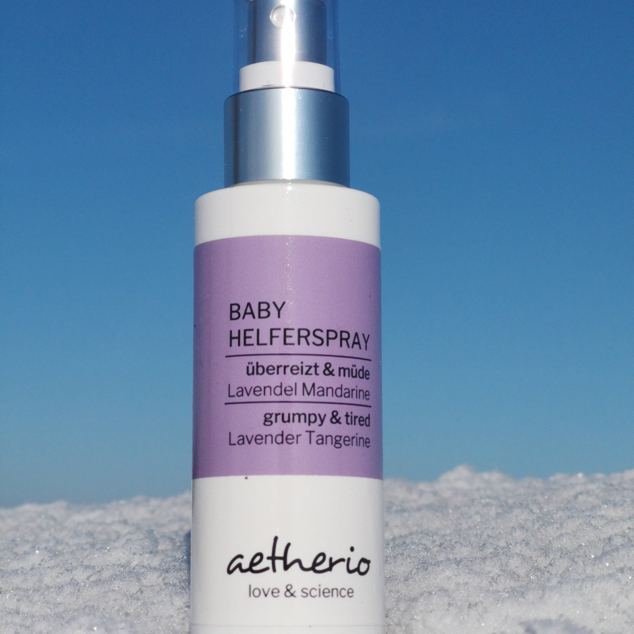 Baby spray bottle with purple label, white bottle, and silver top, aetherio brand