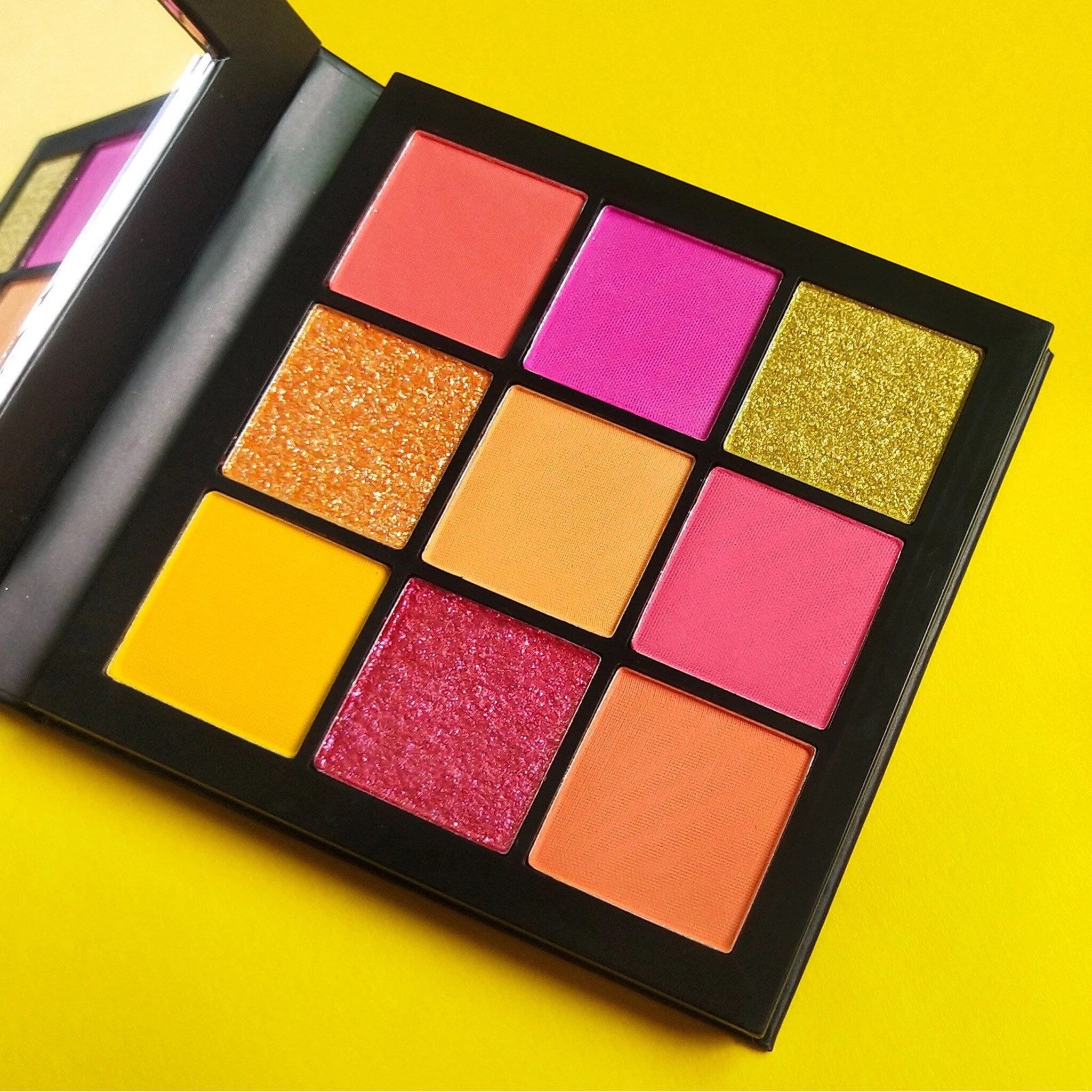 Eye shadow palette with vibrant colors, glitter, and matte finish, Jemaa brand