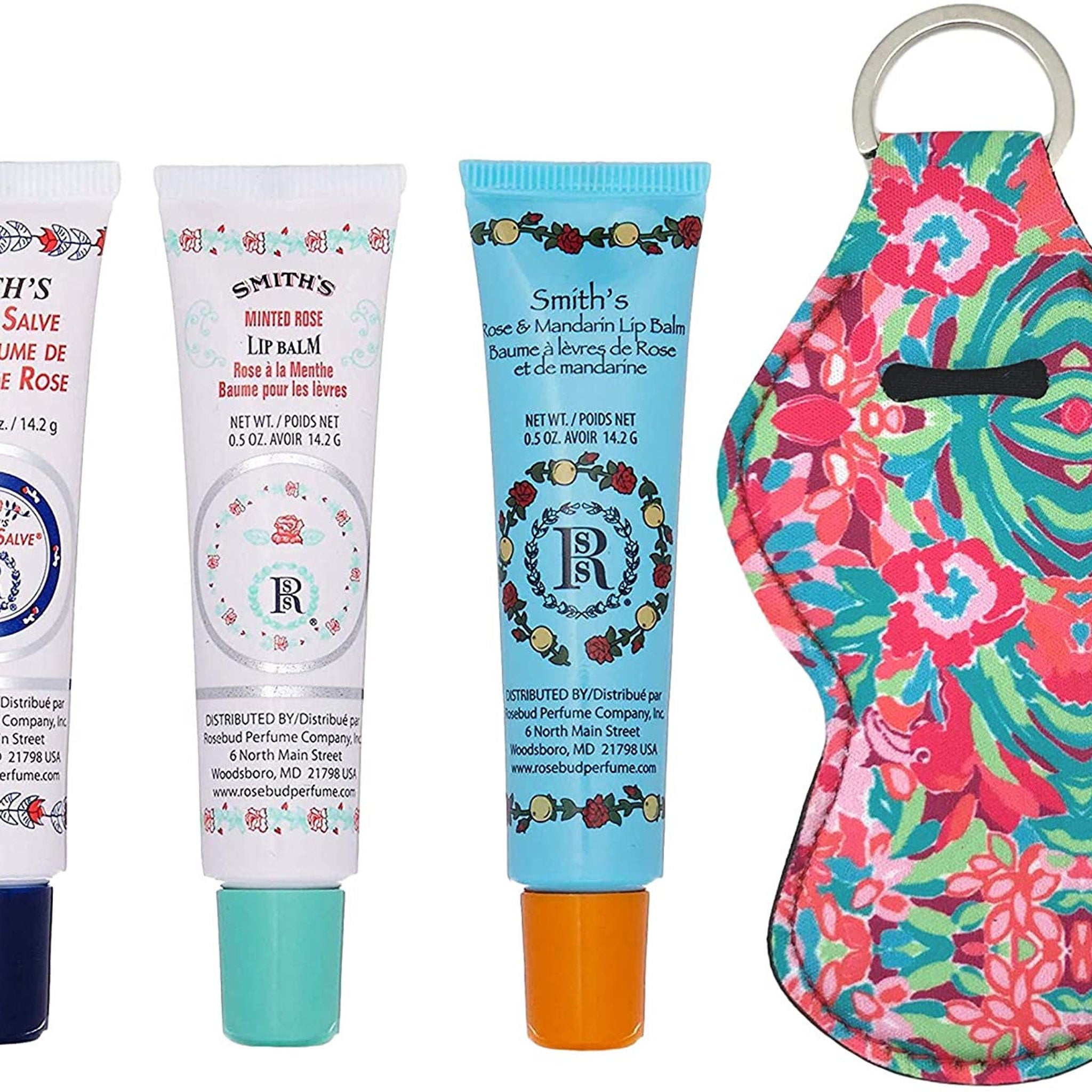 Lip balm tubes in white, blue, and orange with Smith's brand and floral print lip balm holder with keyring