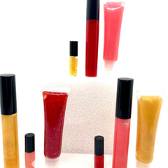 Lip gloss tubes in red, pink, and gold with black caps, assorted sizes, Shining Essentials by Kylee