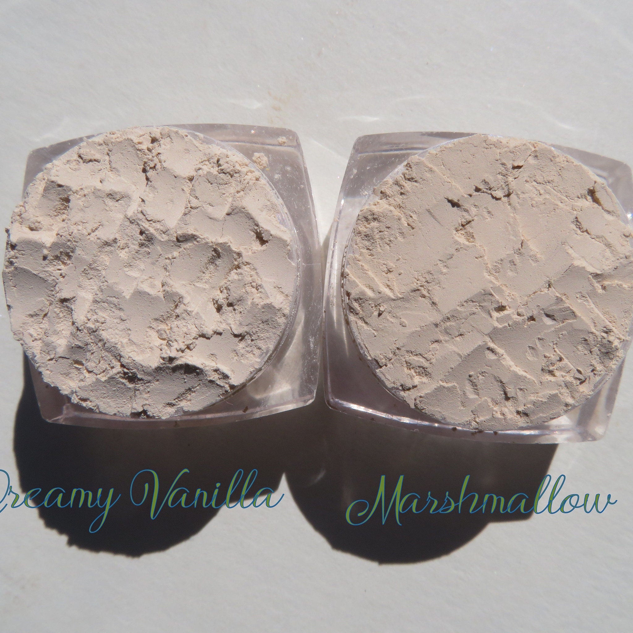 Open compact showing creamy vanilla matte mineral eyeshadow with vegan loose powder and eco-friendly packaging