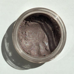 Close-up of Berrylicious Eye Shadow pan showing vibrant berry hue with satin finish