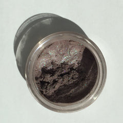 Side view of Berrylicious Eye Shadow pot showing deep berry shimmer and compact size