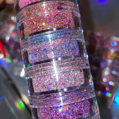 Side view of iridescent chunky glitter stack with multi-color sparkles in compact palette, showcasing texture