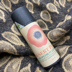 Grapefruit lip balm with pink floral design on kraft paper tube, Desert Poppy brand