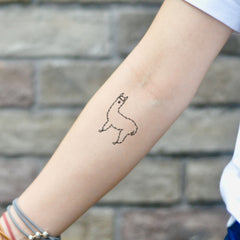 Two hypoallergenic alpaca tattoo stickers on minimalist white packaging with clean typography
