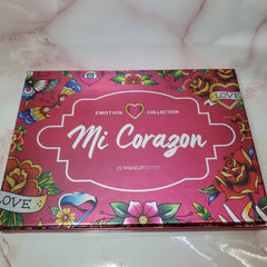MI CORAZON eyeshadow palette with matte and shimmer shades in warm neutrals and bold brights, rectangular compact