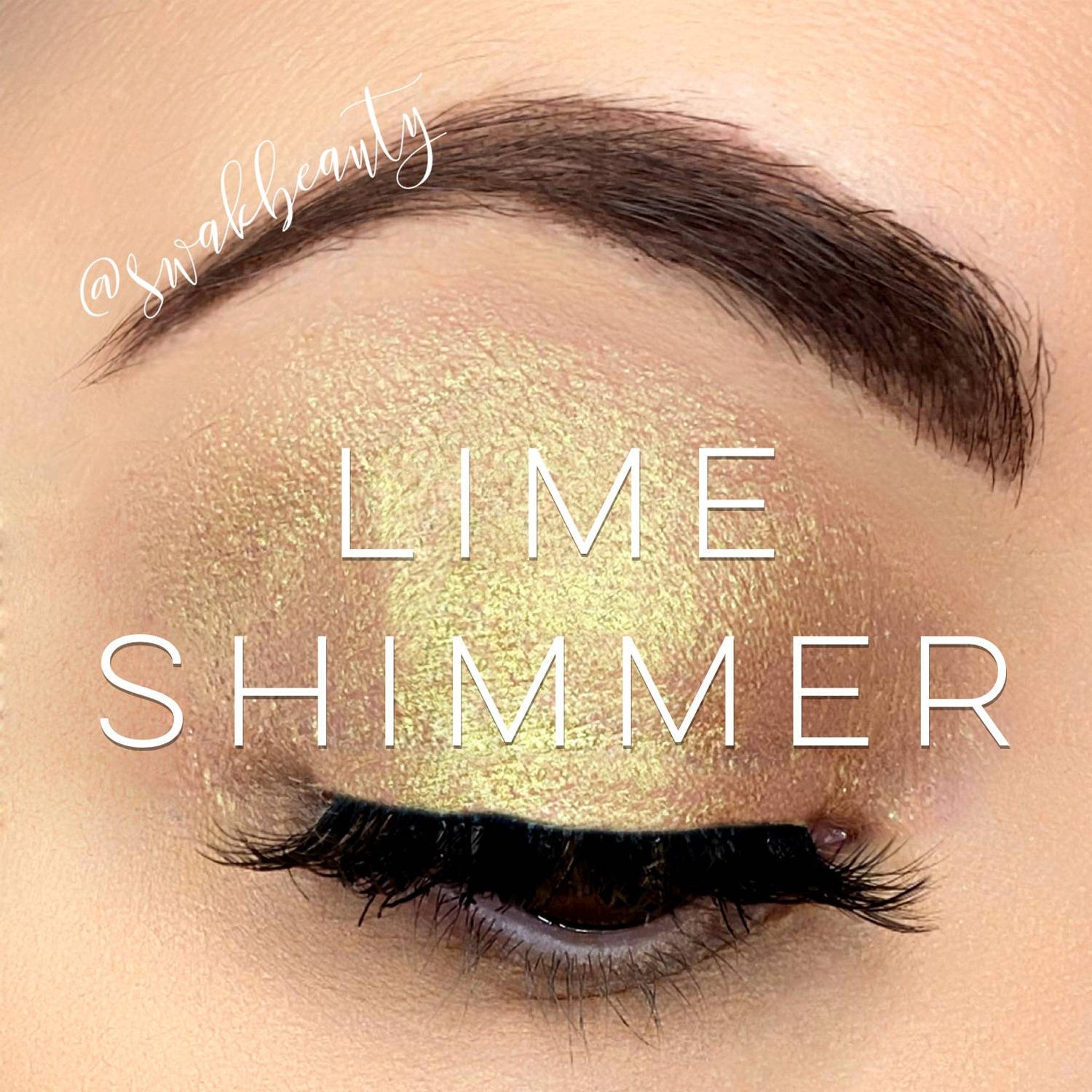 Close-up of lime green shimmer eyeshadow pan showing vibrant metallic finish and smooth powder texture