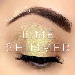 Close-up of lime green shimmer eyeshadow pan showing vibrant metallic finish and smooth powder texture