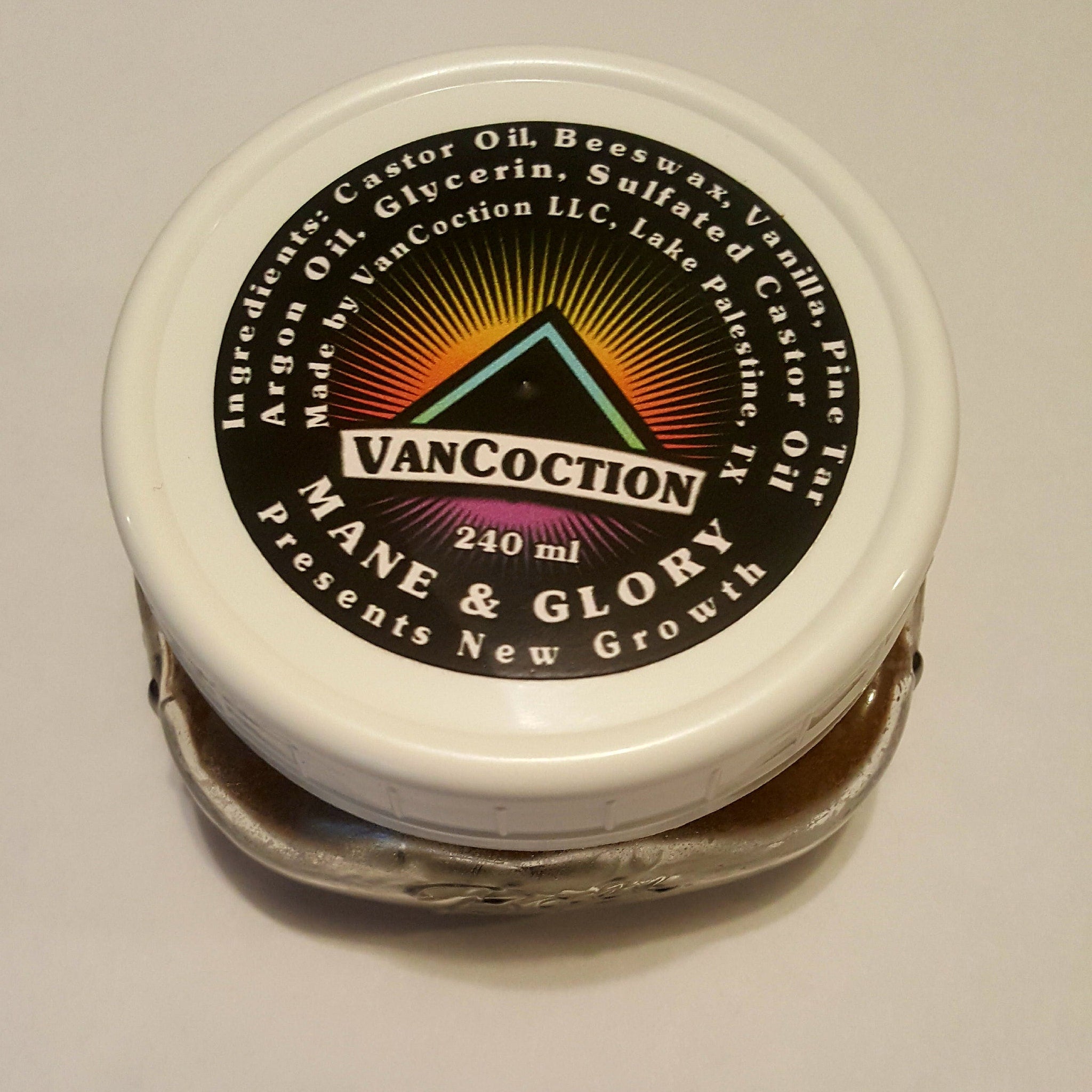 Hair growth product jar with white lid, black label, and VanCoction brand text visible
