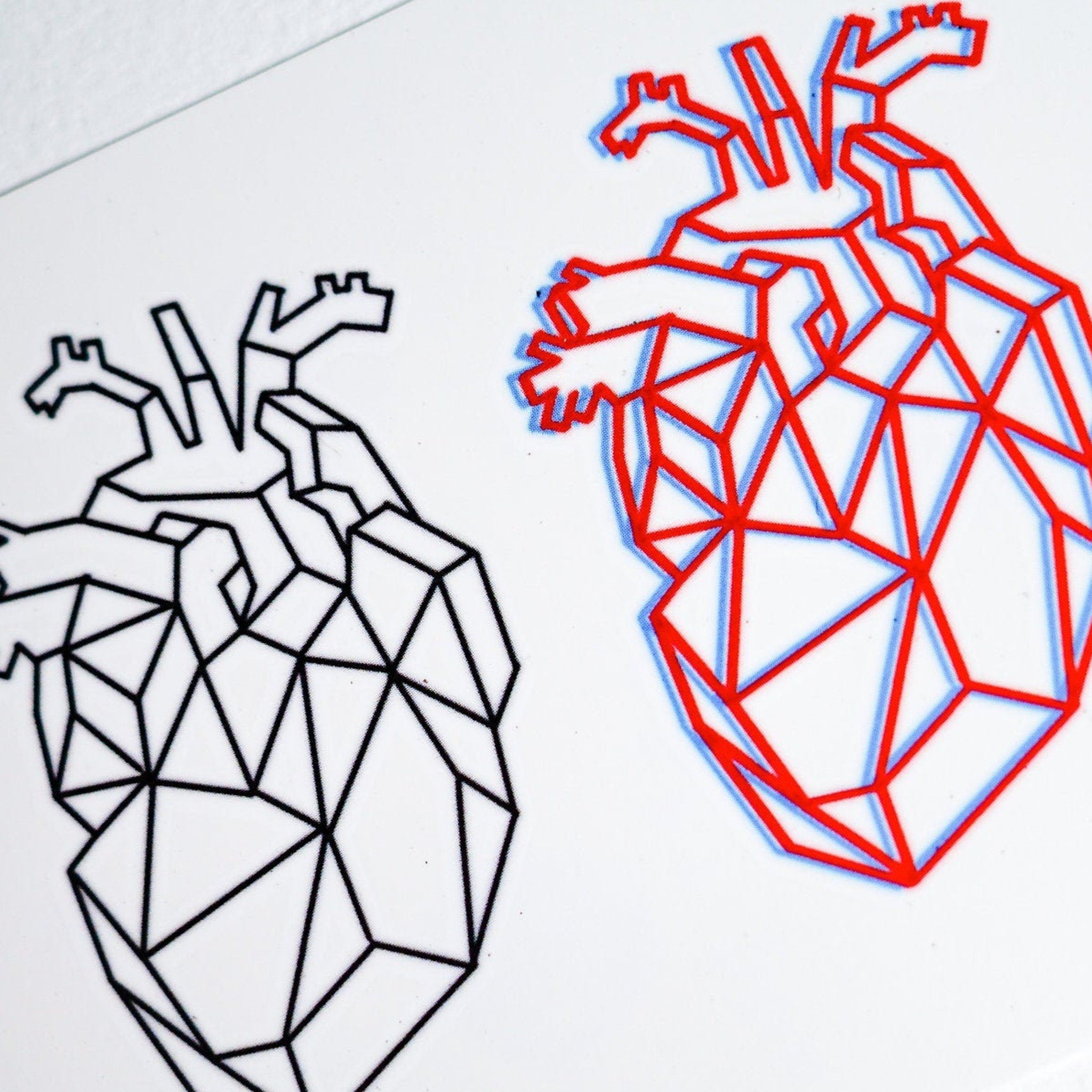 Red geometric heart temporary tattoo sticker on skin with glossy finish, showcasing long-lasting wear for couples