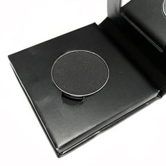 Jet black mineral eye shadow in a square paperboard compact with matte finish and silver brand logo