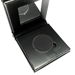 Black matte pressed mineral eyeshadow in compact with sleek silver casing and vegan makeup label