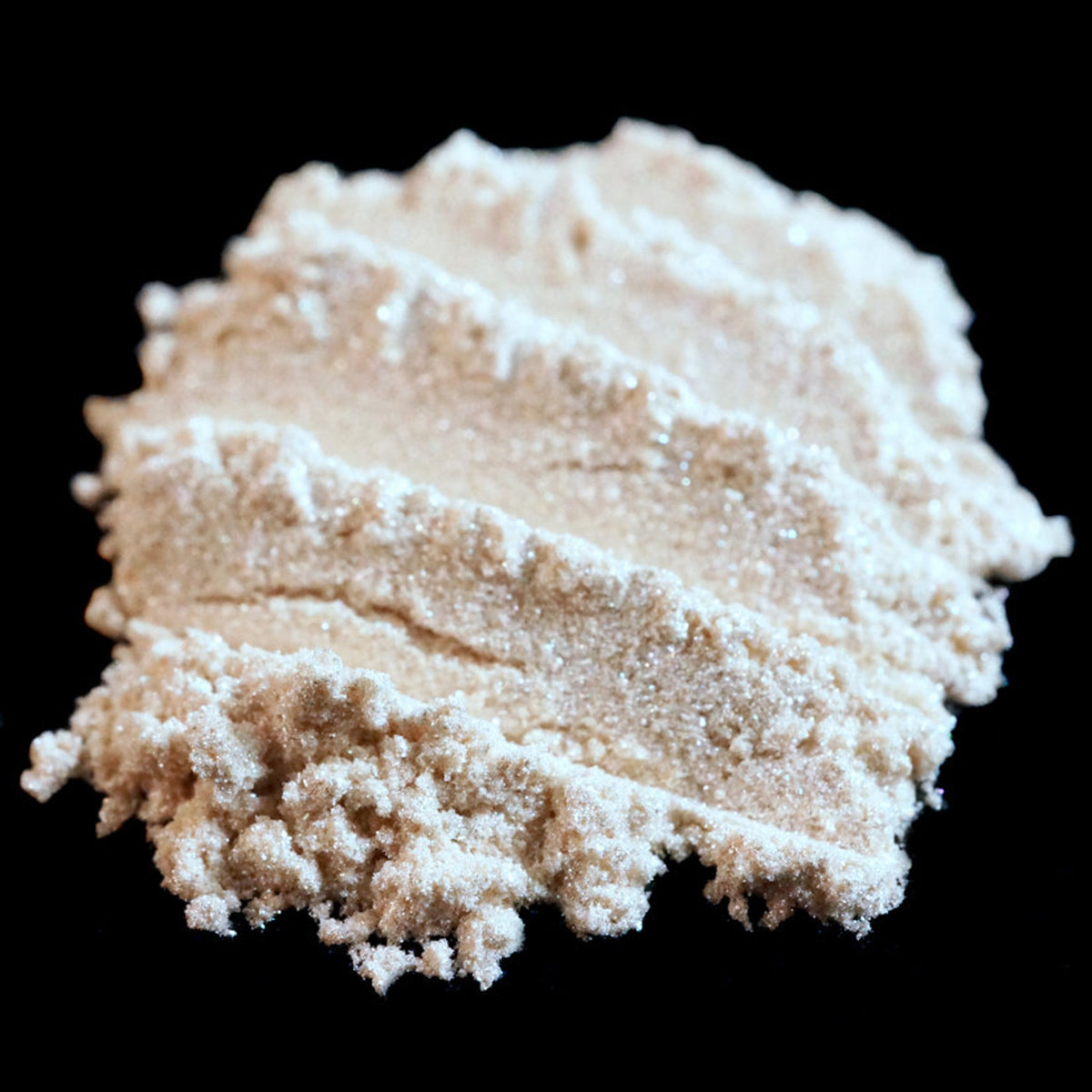 Pale ivory loose eyeshadow with silver and white shimmer glitter in a clear jar, vegan formula