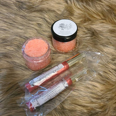 Lip scrub and lip gloss in jars and tubes, orange and pink, Shawzae brand visible