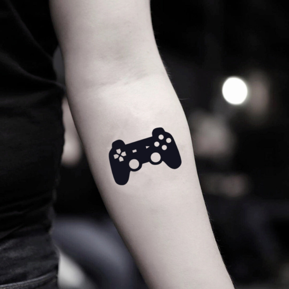 Two temporary tattoo sheets featuring video game controller designs for playful skincare self-expression
