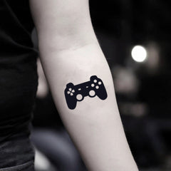 Two temporary tattoo sheets featuring video game controller designs for playful skincare self-expression