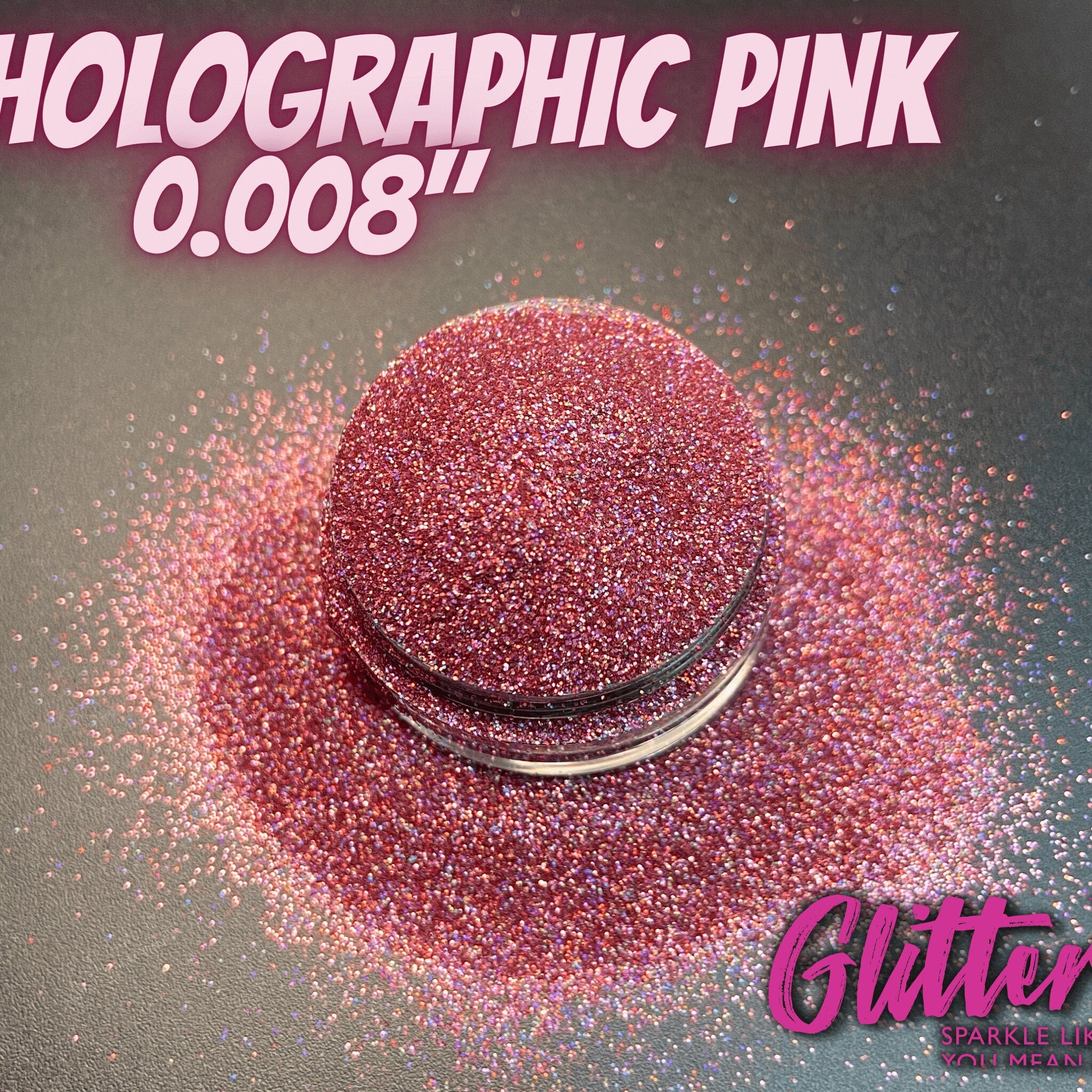 Close-up of holographic pink glitter eyeshadow with ultrafine shimmer in a compact pan