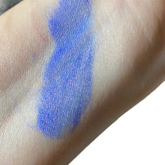Side view of purple and blue mineral eyeshadow pan with vegan mica shimmer in compact case