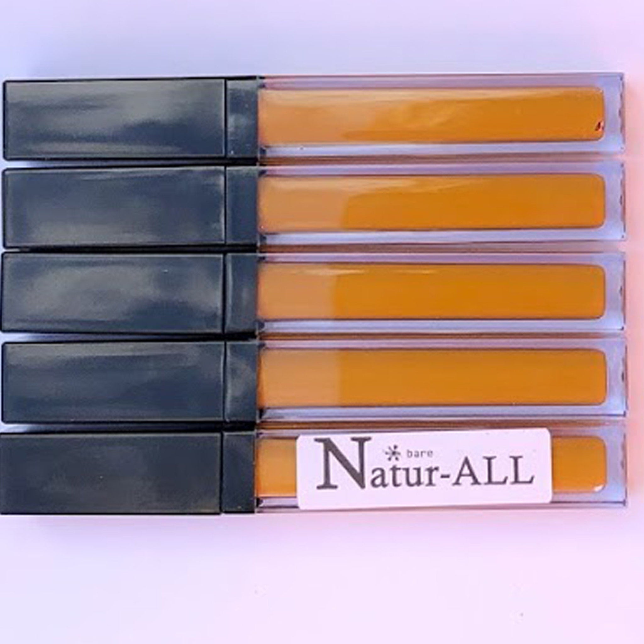 Lip gloss tubes with black caps, clear tubes, and Natur-ALL brand label