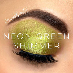 Neon green shimmer eyeshadow applied to eyelid with @swakbeauty text visible