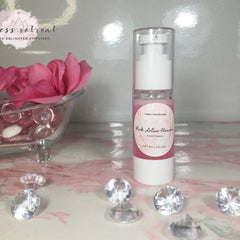 Facial cleanser bottle with pink liquid and white pump, "Pink Lotus Flower" label, Goddess Retreat Boutique brand