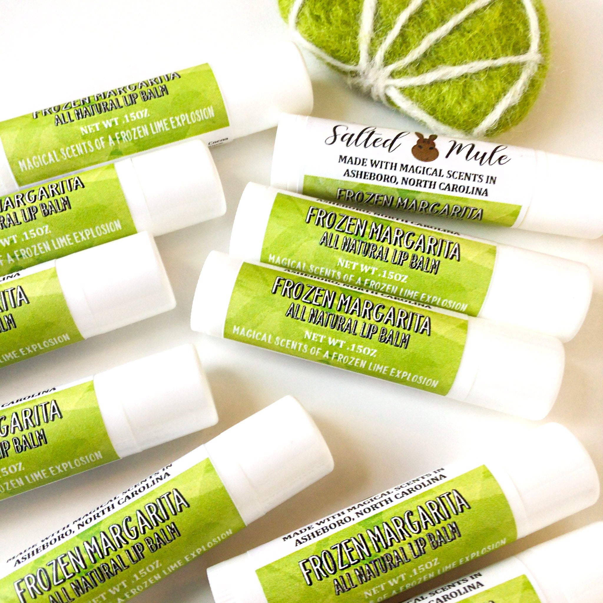 Lip balm tubes, white and green label, "Frozen Margarita" text, for lip care